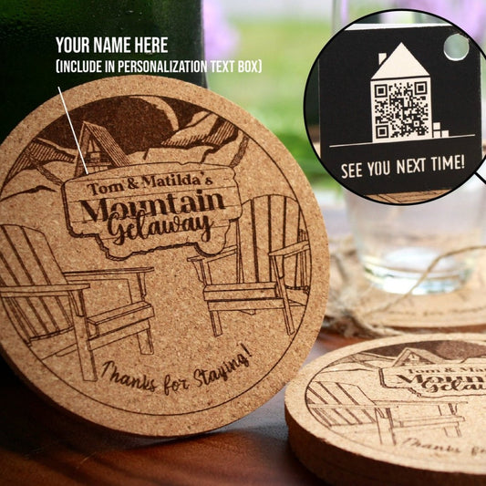 a cork coaster with a picture of a cabin and mountains on it